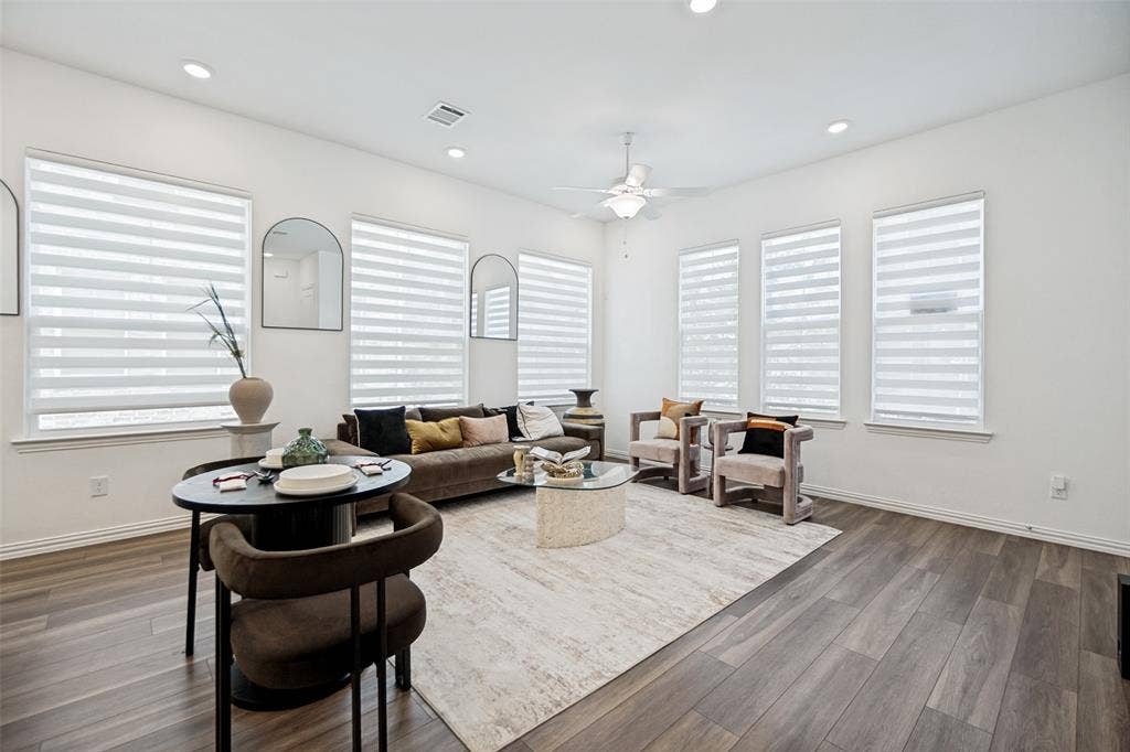 7536 Laburnam Road, Dallas, TX 75228 Recessed lighting, ceiling fan, wood-finish flooring, multiple windows with blinds, and white walls