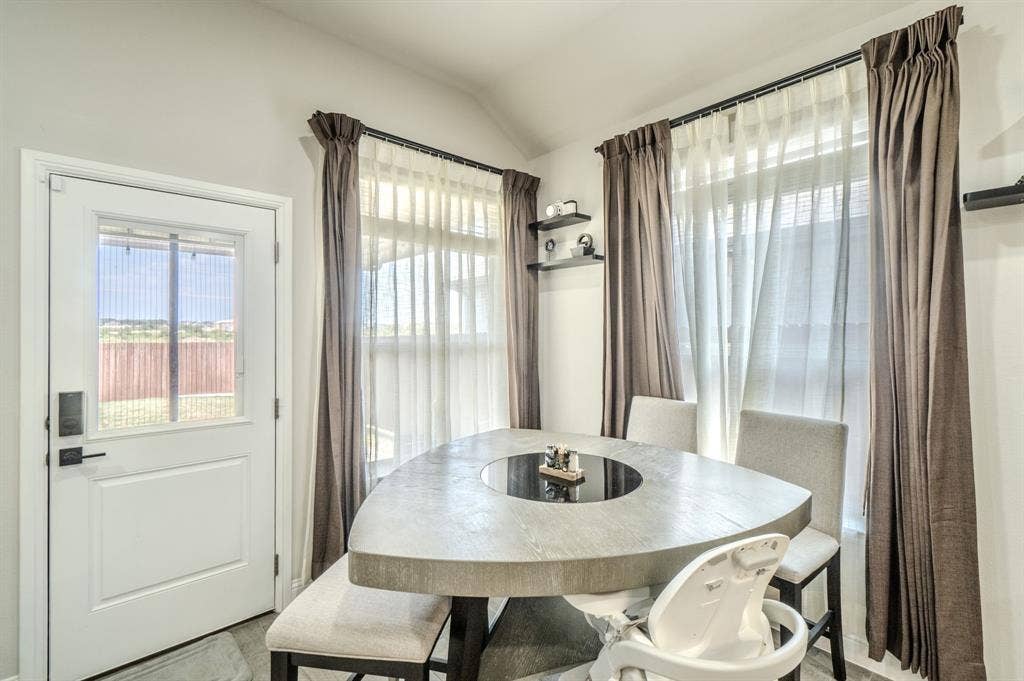 White paneled door with integrated window and black hardware
