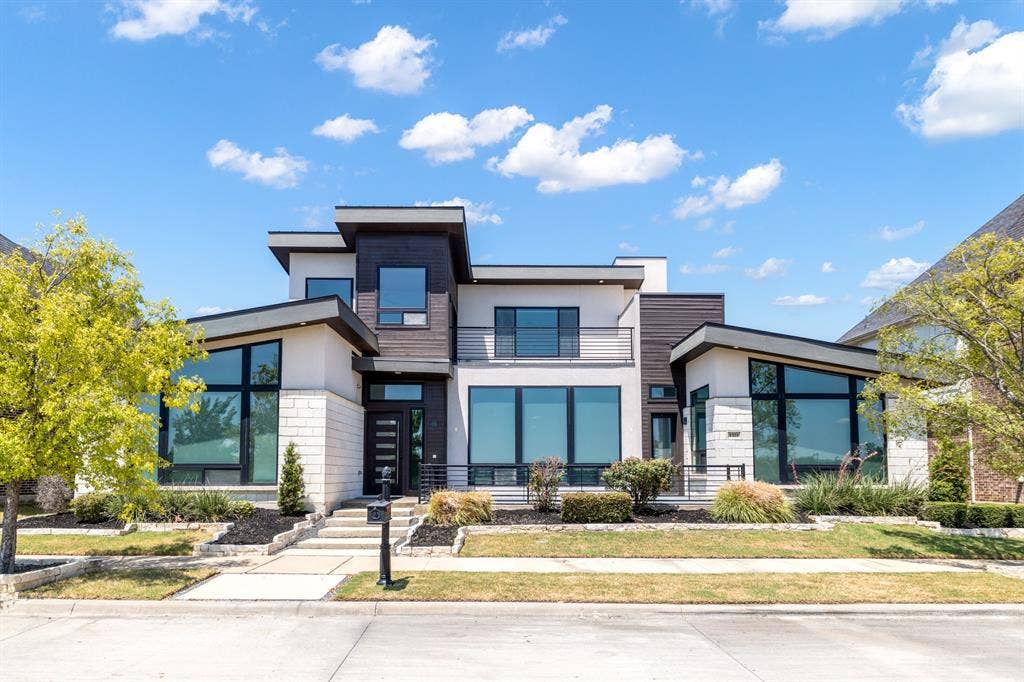 1321 Black Walnut Lane, Arlington, TX 76005 Contemporary exterior featuring mixed material facade, large windows, an integrated balcony, and tiered landscaping