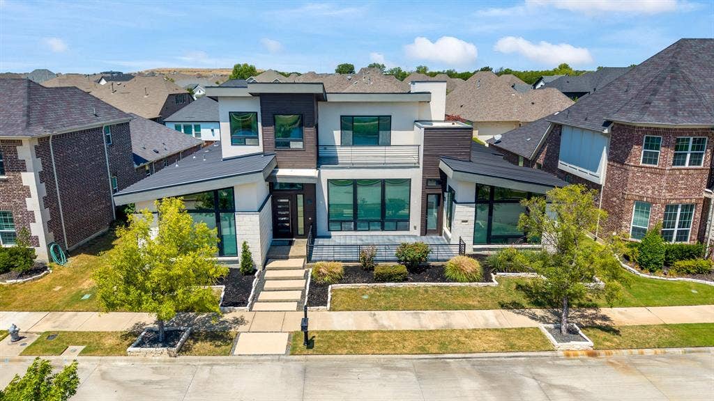 1321 Black Walnut Lane, Arlington, TX 76005 Contemporary multi-story facade featuring varied cladding, a prominent entry with a modern door, and expansive windows