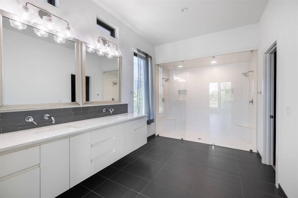 1321 Black Walnut Lane, Arlington, TX 76005 Dual vanity with undermount sinks, wall-mounted faucets, and an expansive quartz countertop