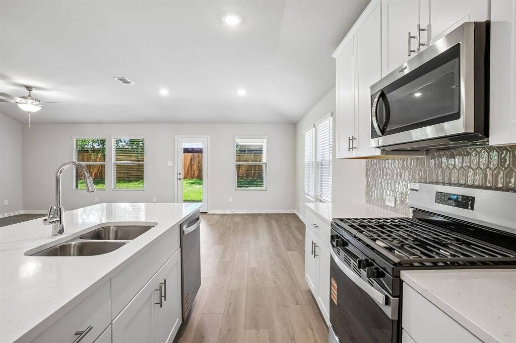 2138 Longchamp Lane, Seagoville, TX 75159 Photo is not of the actual home, but is an inspirational photo of builder’s model home and may depict options, furnishings, and/or decorator features that are not included.