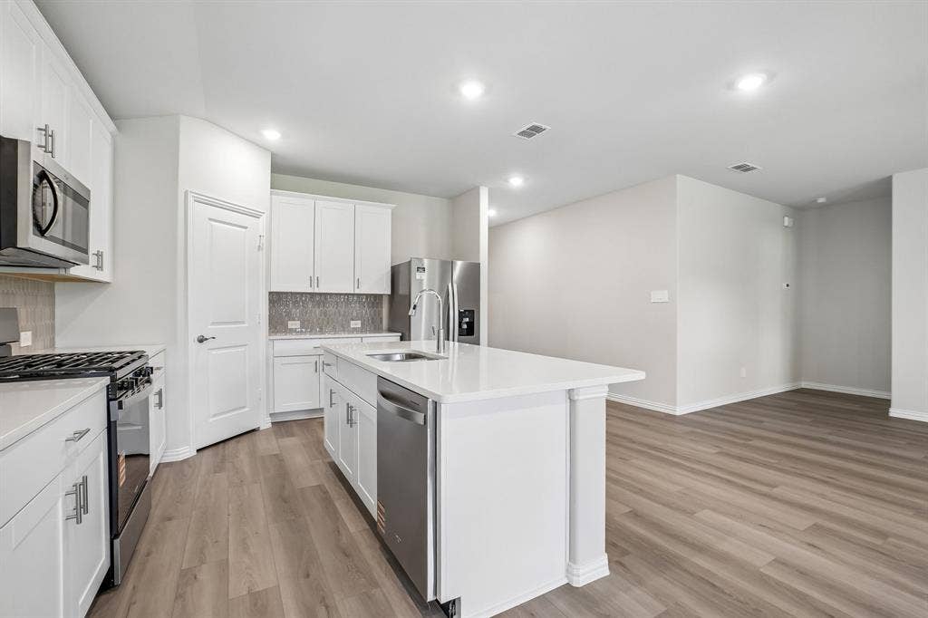 2138 Longchamp Lane, Seagoville, TX 75159 Photo is not of the actual home, but is an inspirational photo of builder’s model home and may depict options, furnishings, and/or decorator features that are not included.