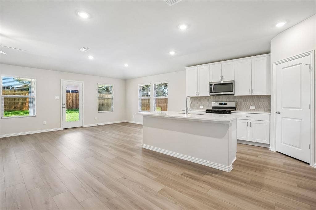 2138 Longchamp Lane, Seagoville, TX 75159 Photo is not of the actual home, but is an inspirational photo of builder’s model home and may depict options, furnishings, and/or decorator features that are not included.