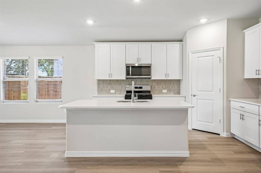 2138 Longchamp Lane, Seagoville, TX 75159 Photo is not of the actual home, but is an inspirational photo of builder’s model home and may depict options, furnishings, and/or decorator features that are not included.