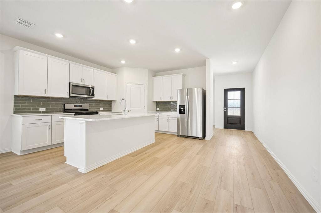 2130 Longchamp Lane, Seagoville, TX 75159 Photo is not of the actual home, but is an inspirational photo of builder’s model home and may depict options, furnishings, and/or decorator features that are not included.