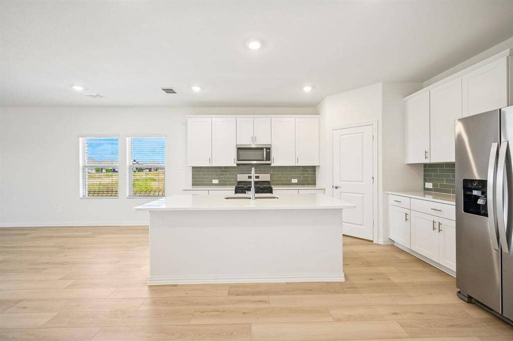 2130 Longchamp Lane, Seagoville, TX 75159 Photo is not of the actual home, but is an inspirational photo of builder’s model home and may depict options, furnishings, and/or decorator features that are not included.