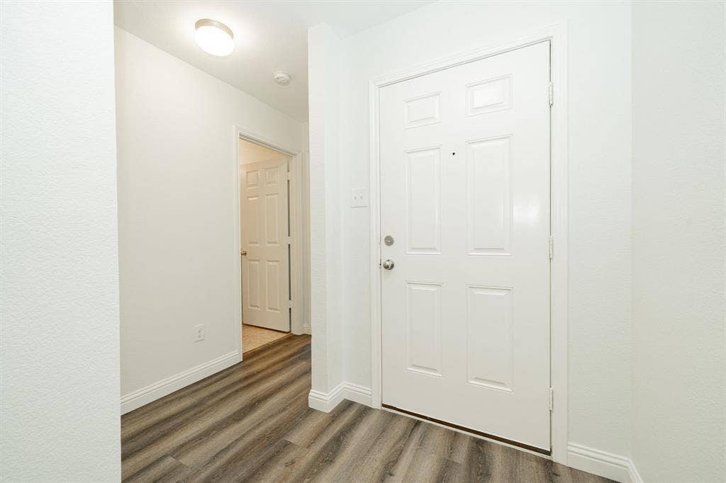 122 Feverbush Drive, Fate, TX 75189 Entryway with wood finished floors and baseboards