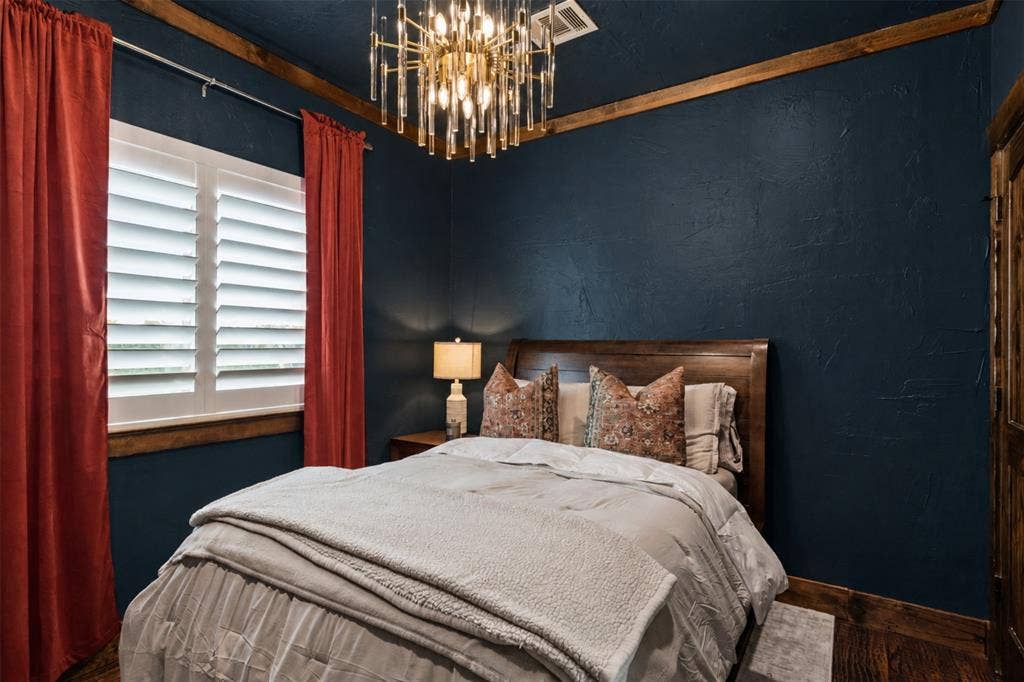 623 Calm Water Cove, Princeton, TX 75407 Wood-finish flooring, plantation shutters, and a distinctive wood-beamed ceiling