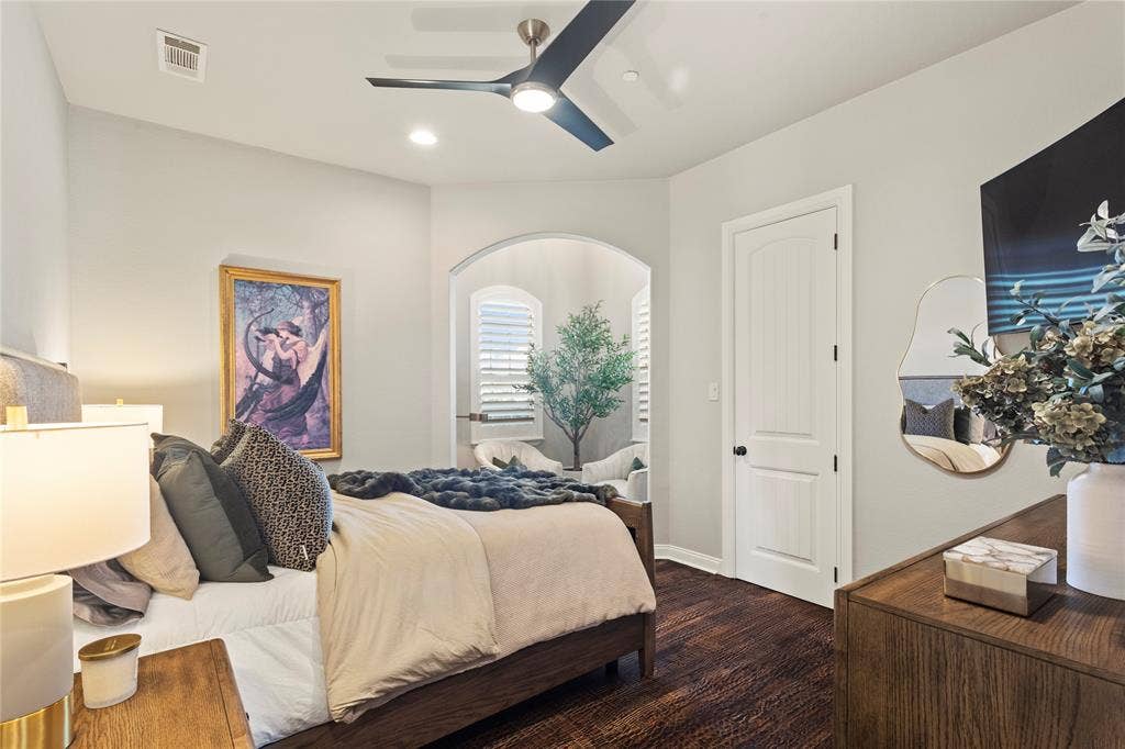623 Calm Water Cove, Princeton, TX 75407 Recessed lighting, ceiling fan, arched doorway, wood-finish flooring, and a paneled interior door