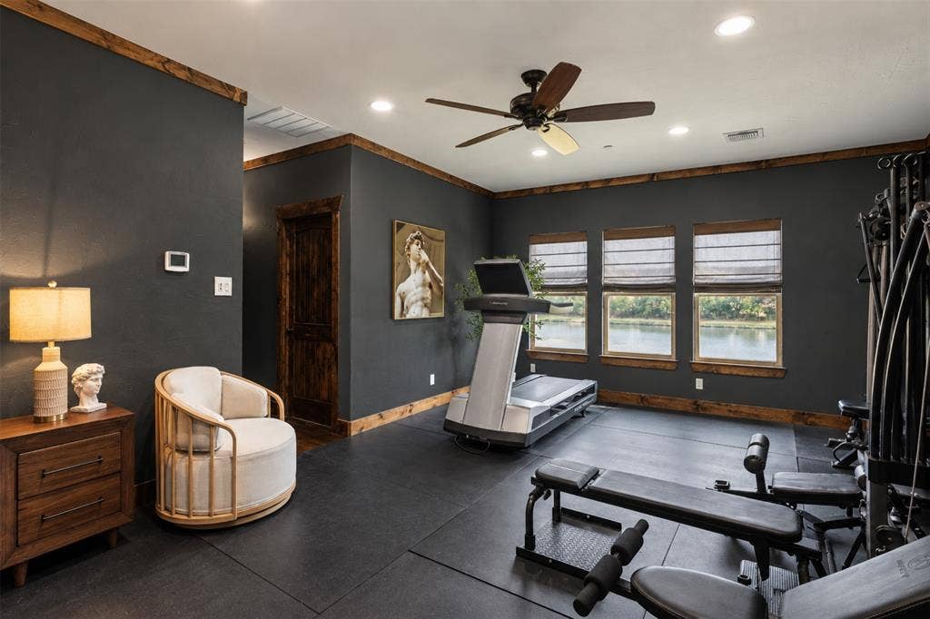 623 Calm Water Cove, Princeton, TX 75407 Recessed lighting, ceiling fan, wood-finish trim throughout, dark-toned walls, and multiple windows