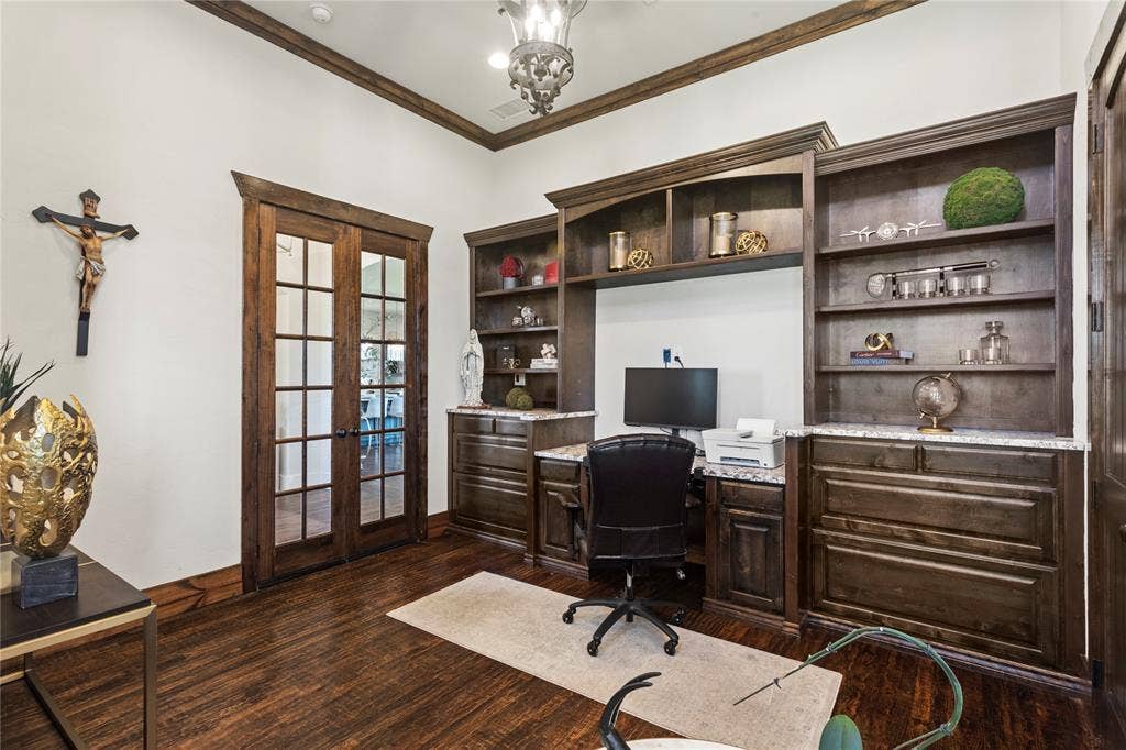 623 Calm Water Cove, Princeton, TX 75407 Wood-finish flooring, built-in cabinetry with shelving, French doors with glass panes, crown molding, and granite-look countertops