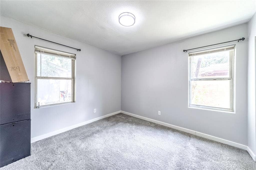 726 Royal Crest, Mesquite, TX 75149 Carpeted spare room featuring baseboards