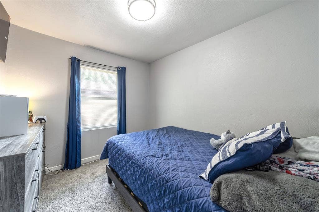 726 Royal Crest, Mesquite, TX 75149 Bedroom with light colored carpet and baseboards