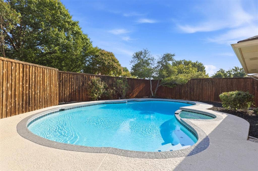 2411 Aspen Street, Richardson, TX 75082 In-ground swimming pool with integrated spa and concrete decking