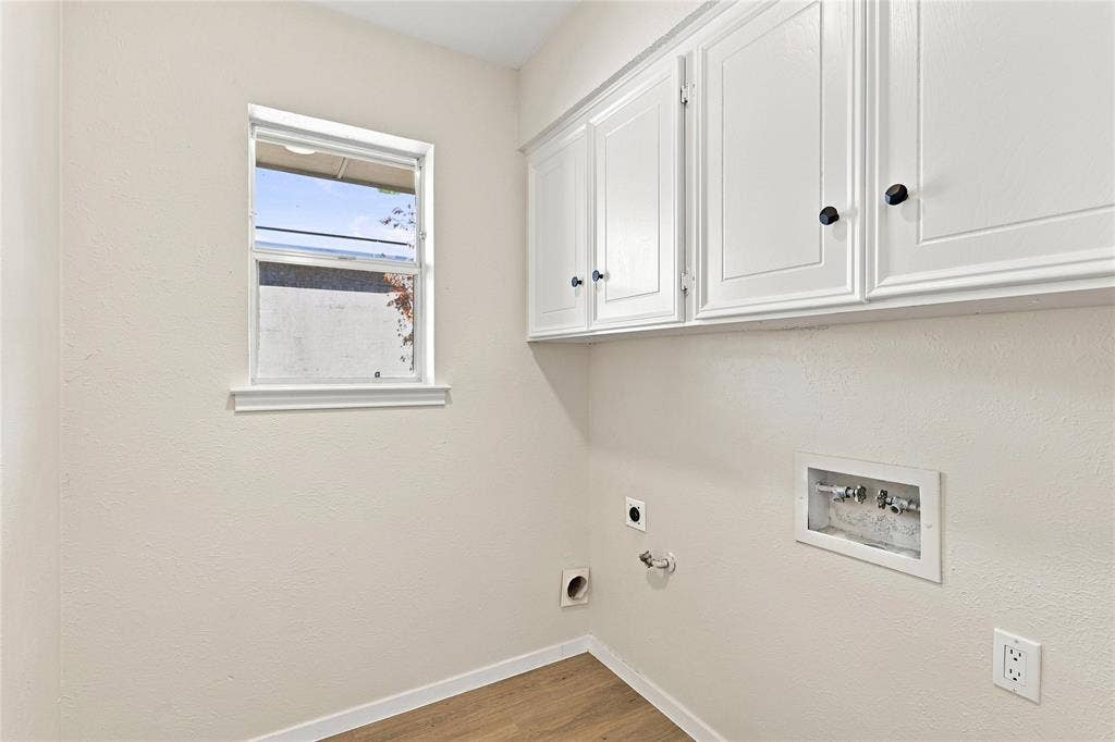 2411 Aspen Street, Richardson, TX 75082 White shaker-style cabinetry with black hardware