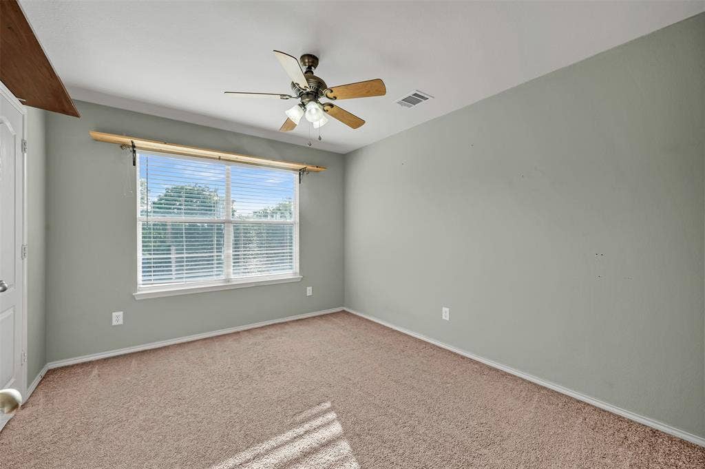 9017 Graywolf Ridge Trail, Fort Worth, TX 76244 Empty room featuring carpet flooring and ceiling fan