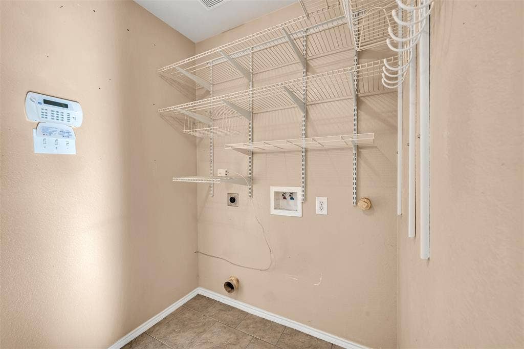 9017 Graywolf Ridge Trail, Fort Worth, TX 76244 Laundry area featuring washer hookup, tile floors, and hookup for an electric dryer