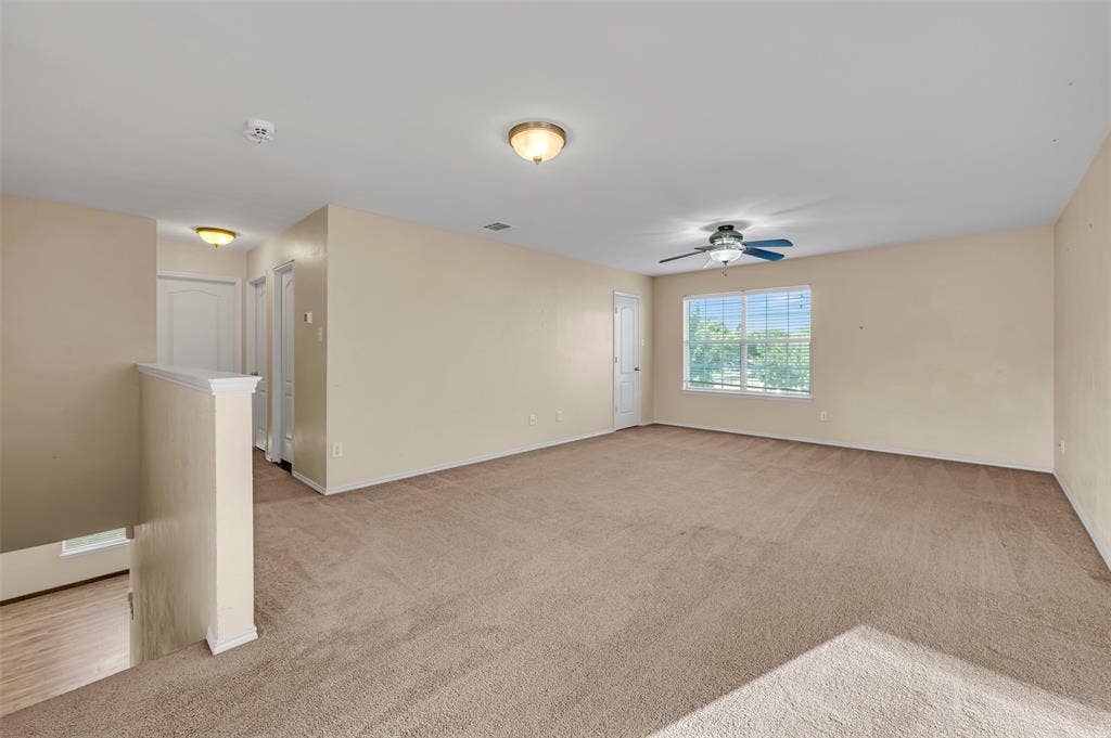 9017 Graywolf Ridge Trail, Fort Worth, TX 76244 Carpeted empty room with ceiling fan