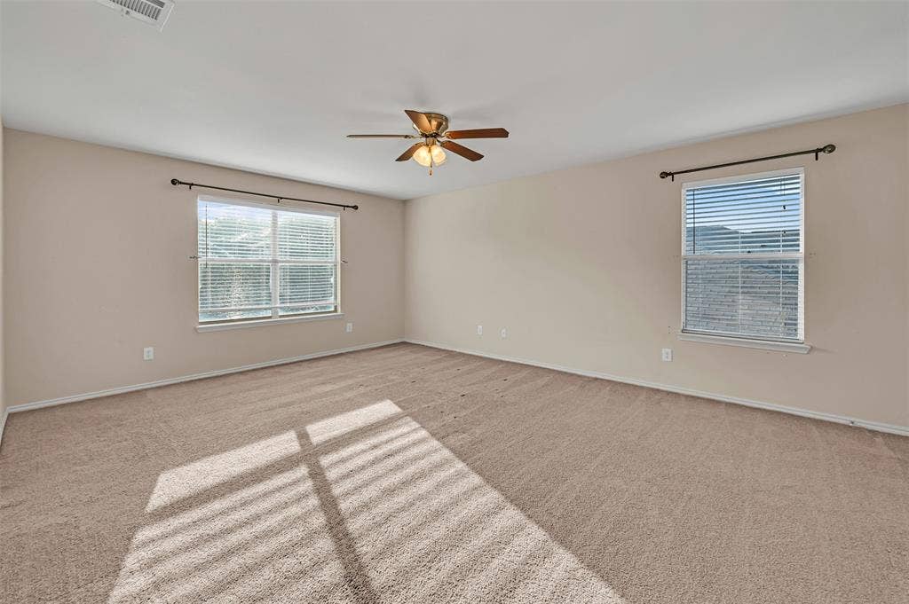 9017 Graywolf Ridge Trail, Fort Worth, TX 76244 Carpeted spare room featuring ceiling fan