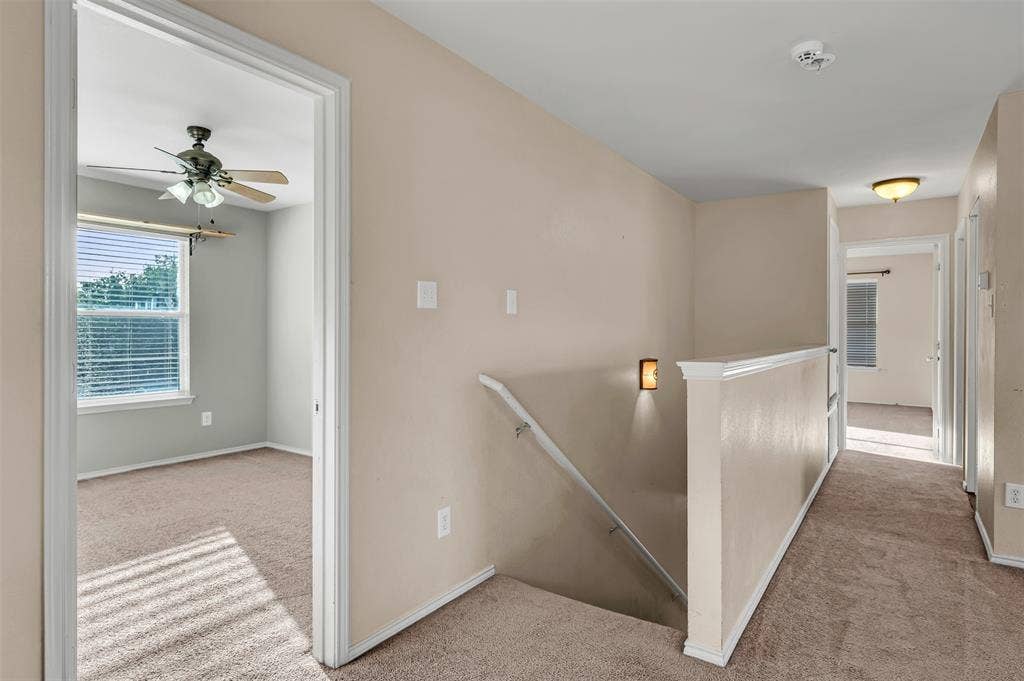 9017 Graywolf Ridge Trail, Fort Worth, TX 76244 Hallway with light carpet