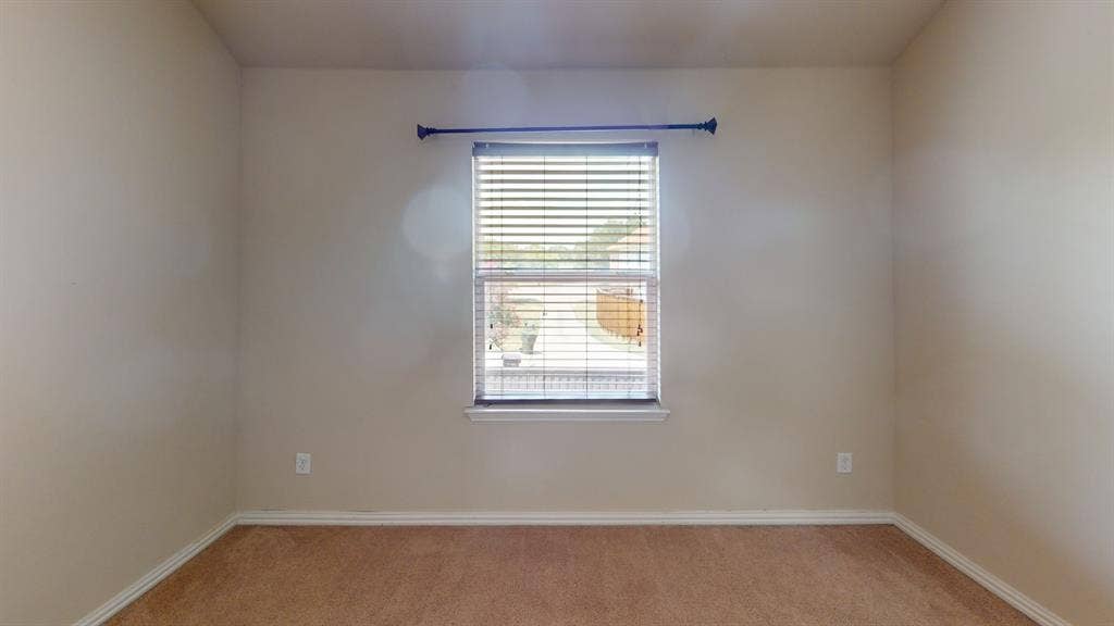 4651 Penelope Lane, Plano, TX 75024 Carpeted flooring, single window with blinds, window sill, and a dark finish curtain rod