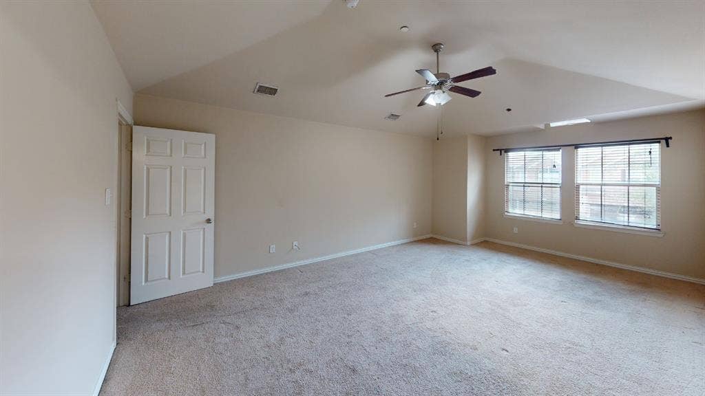 4651 Penelope Lane, Plano, TX 75024 Spacious room featuring vaulted ceilings, carpeted flooring, a ceiling fan, and two windows