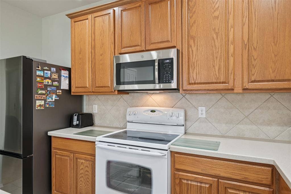 Wood-finish cabinetry paired with light countertops