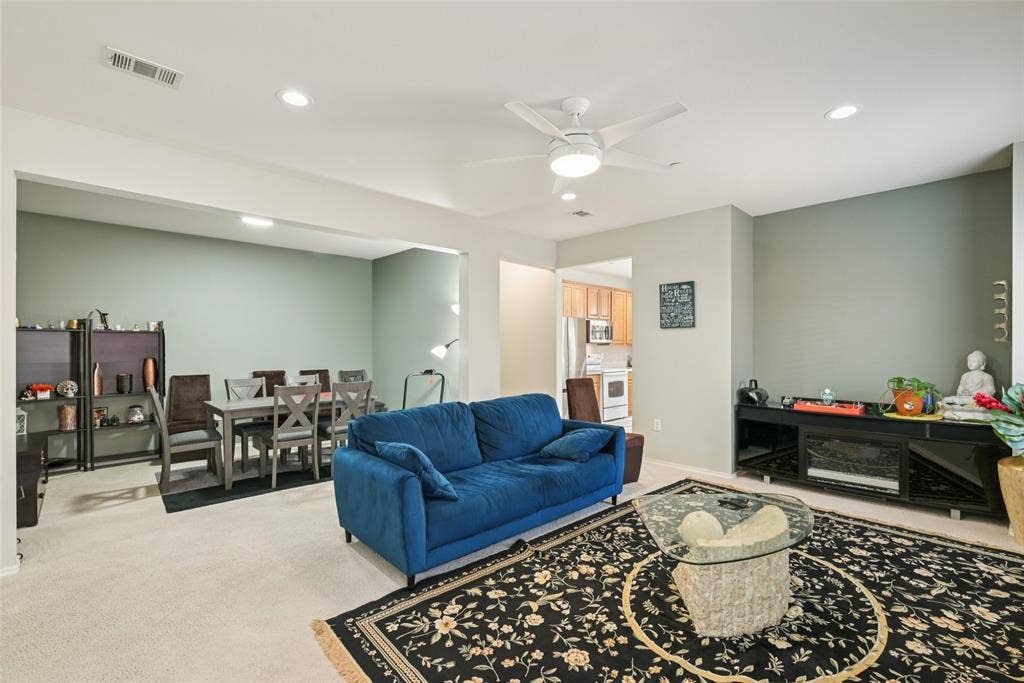 Recessed lighting, ceiling fan, carpeting, and light-colored walls