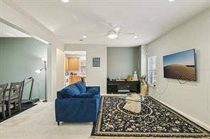 Recessed lighting throughout, ceiling fan, and carpeted flooring in the living area