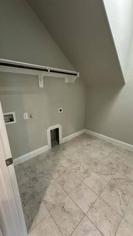 Spacious reach-in closet featuring six built-in shelves with white painted trim and soft natural lighting