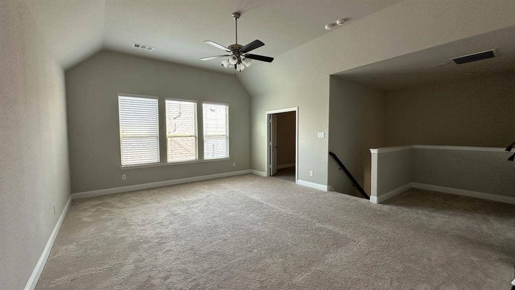 Tiled flooring, white baseboards, and a built-in hanging rod