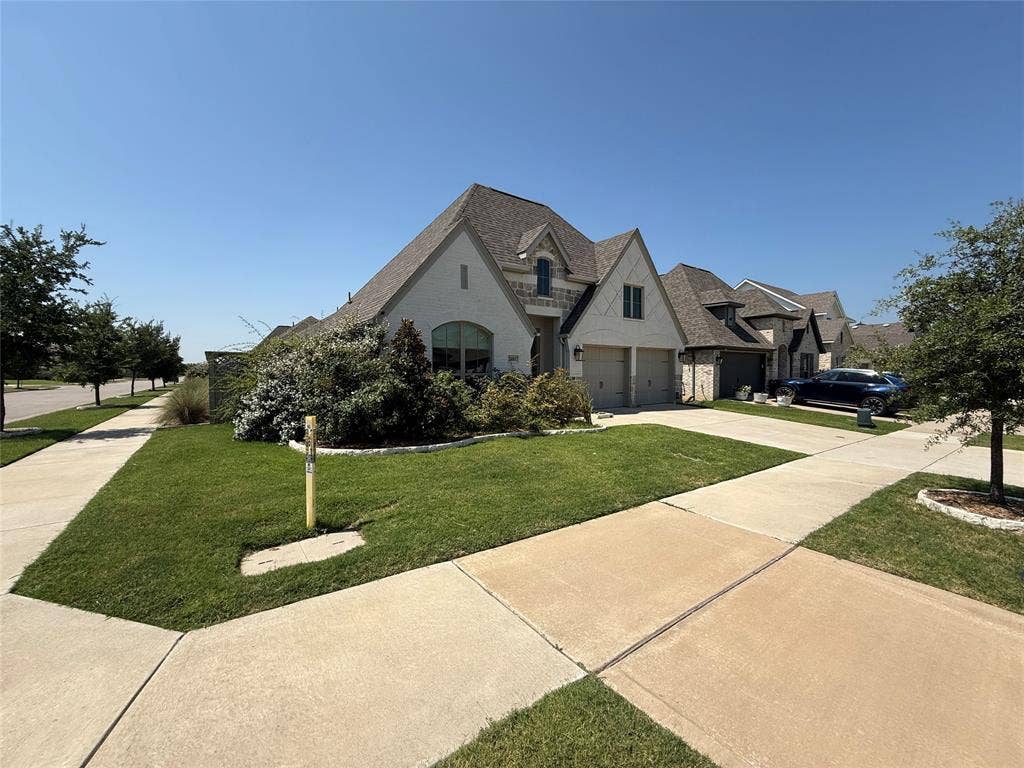 2401 Robin Way, Northlake, TX 76247 Light-colored brick exterior with a multi-pitched roofline