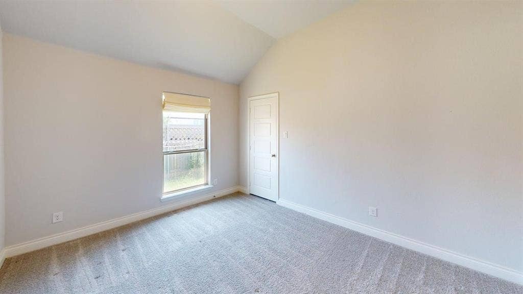 2401 Robin Way, Northlake, TX 76247 Vaulted ceiling, neutral wall paint, light gray carpeting, single window with roller shade, white trim