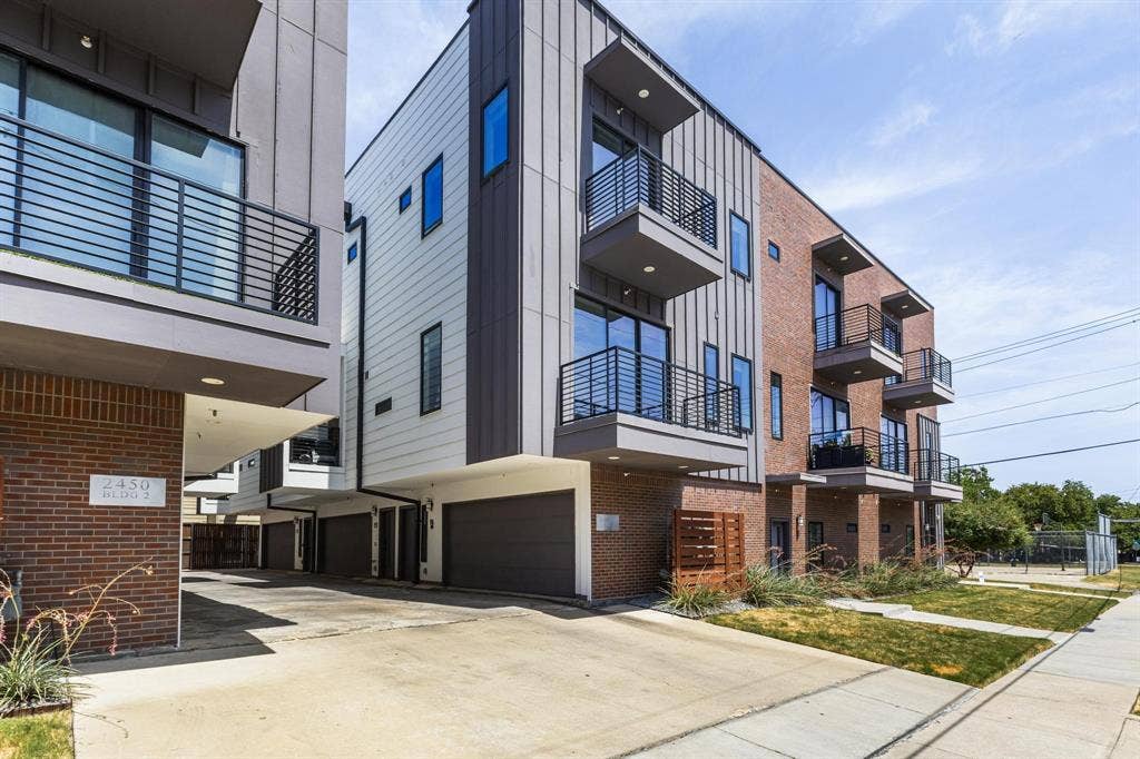 2450 N Garrett Avenue, #14, Dallas, TX 75206 Modern facade featuring brick, vertical siding, and horizontal paneling