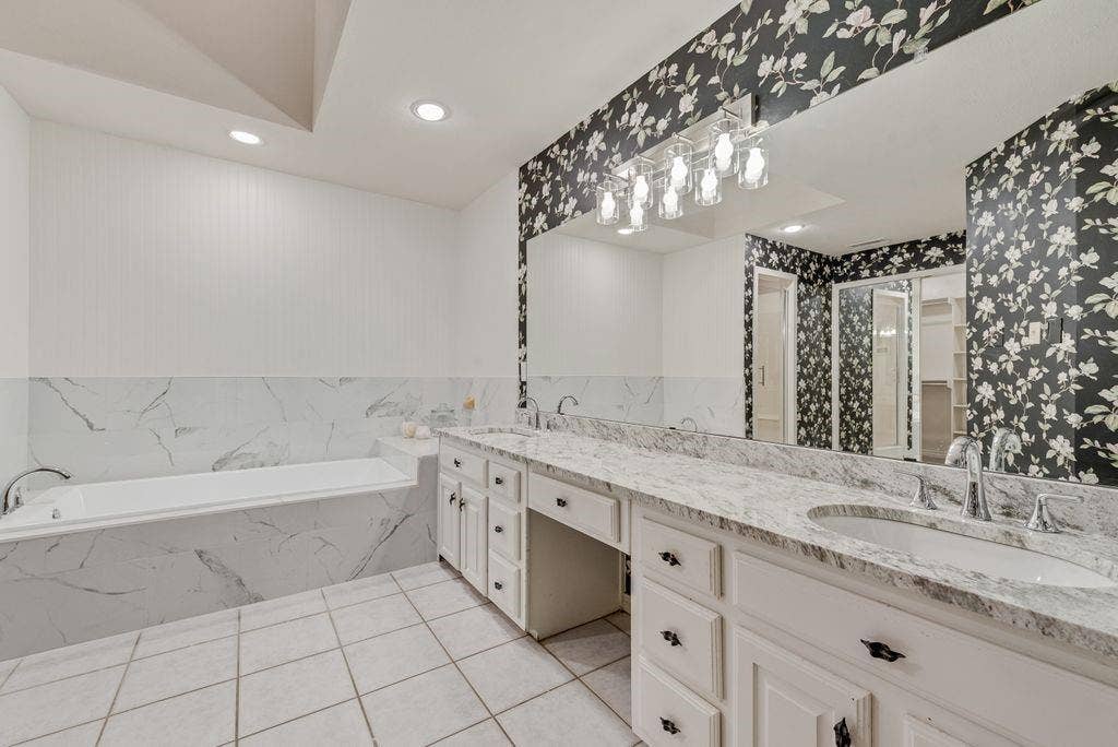 2 Eastshore Road, Heath, TX 75032 Dual vanity with stone-finish countertops, undermount sinks, and chrome fixtures
