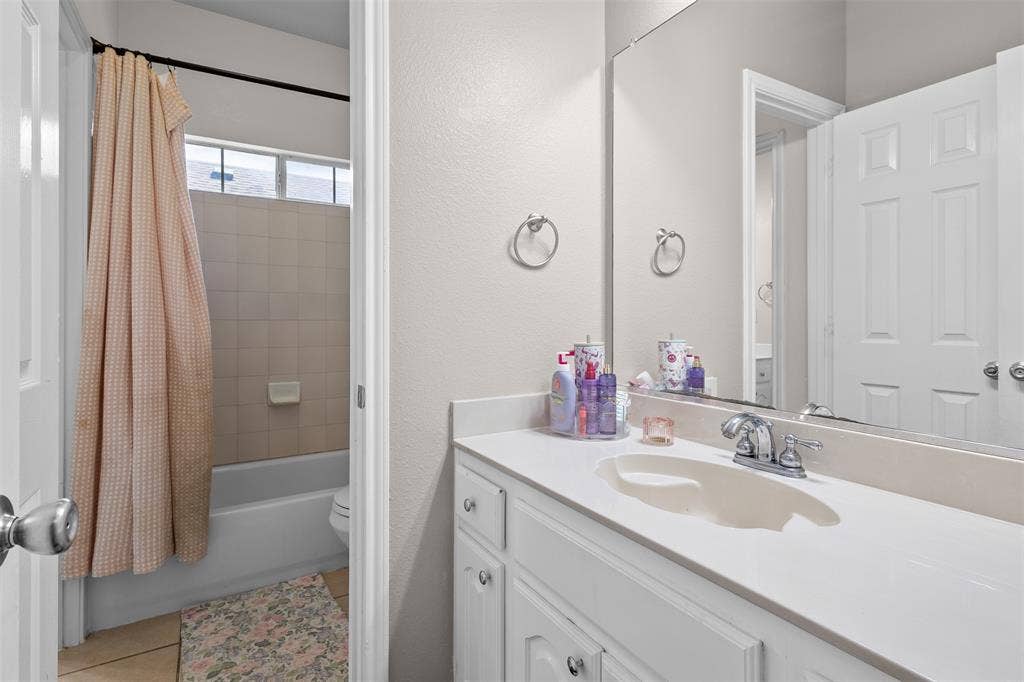 5413 Compassion Drive, Midlothian, TX 76065 White vanity with integrated sink, chrome faucet, and expansive wall-mounted mirror