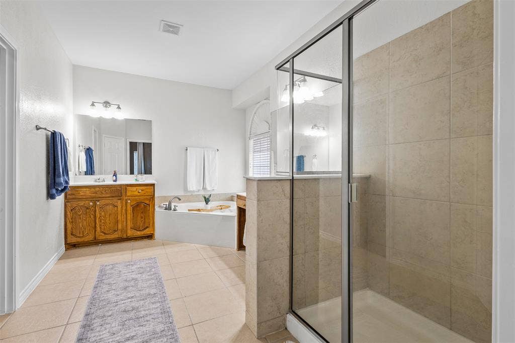 5413 Compassion Drive, Midlothian, TX 76065 Walk-in shower with clear glass enclosure and tiled walls