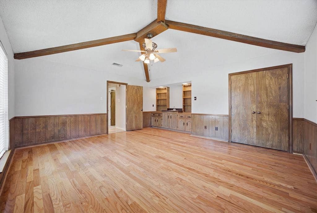 4001 Keele Drive, Garland, TX 75041 This spacious room with vaulted beamed ceiling could be a bedroom, game room, home gym...make it your own. Built-in cabinets, shelves and also a sink!