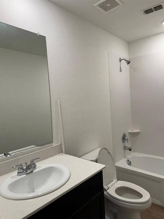 5705 Manarchos Lane, Forney, TX 75126 Bathroom with vanity, washtub / shower combination, and a textured wall