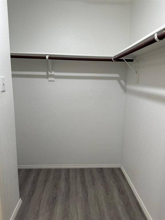 5705 Manarchos Lane, Forney, TX 75126 Spacious closet featuring wood finished floors