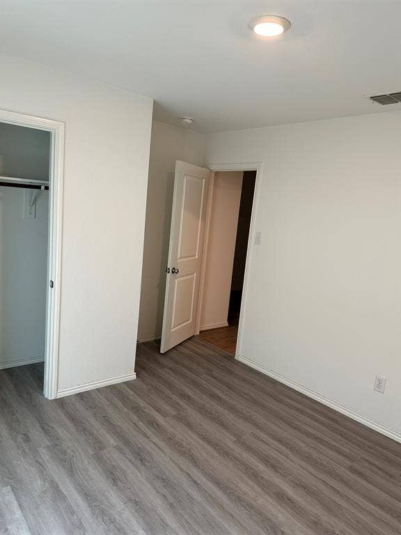 5705 Manarchos Lane, Forney, TX 75126 Unfurnished bedroom with wood finished floors