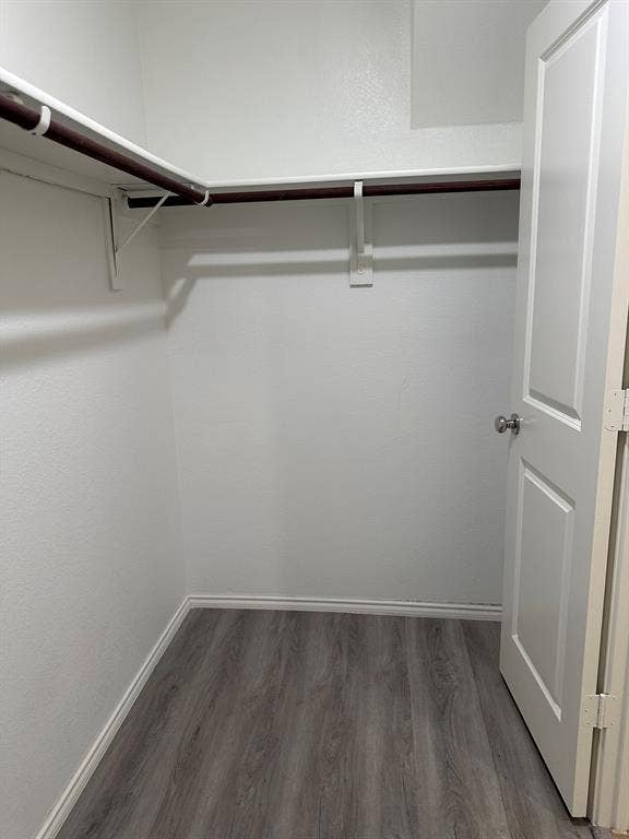 5705 Manarchos Lane, Forney, TX 75126 Walk in closet with wood finished floors