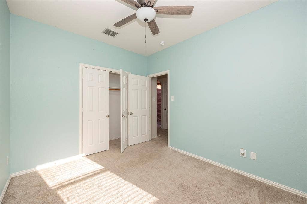 5728 Calloway Drive, McKinney, TX 75070 Soft blue walls complement plush gray carpeting