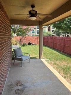 1316 Shelley Drive, Burleson, TX 76028 Covered patio with a ceiling fan, concrete flooring, and brick exterior wall