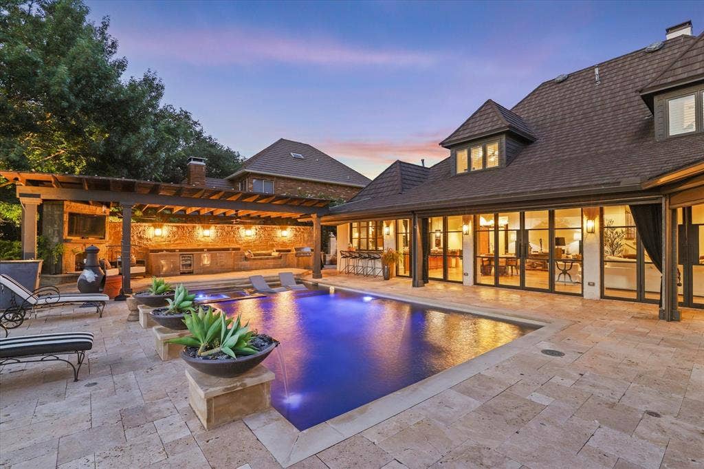 5 SAVANNAH Circle, Frisco, TX 75034 Resort-style pool transforms the backyard into a private retreat for relaxing and entertaining.