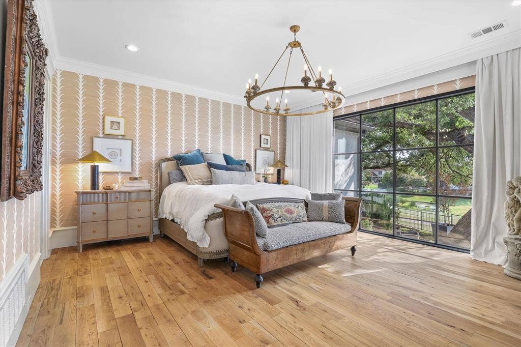 5 SAVANNAH Circle, Frisco, TX 75034 Serene primary suite with hardwood floors, beautiful natural light and tranquil views of the surrounding landscape.