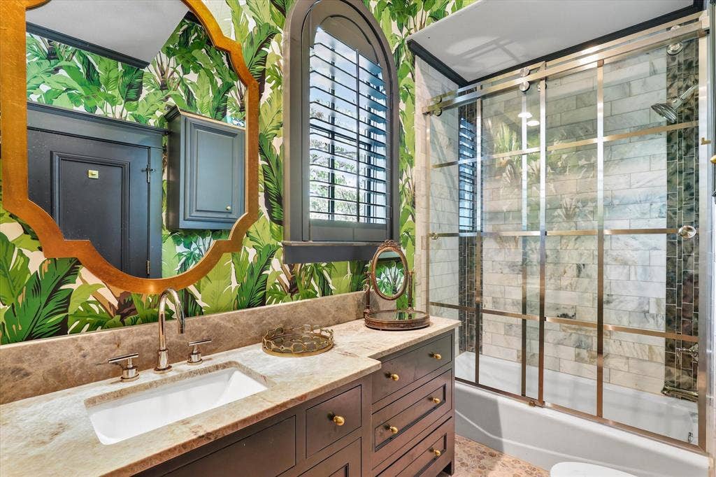 5 SAVANNAH Circle, Frisco, TX 75034 One-of-a-kind secondary bath brings an unexpected designer moment with bold finishes and a glass-enclosed shower.