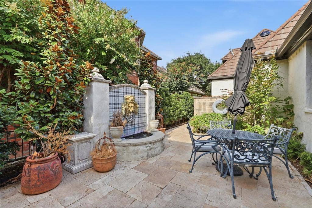 5 SAVANNAH Circle, Frisco, TX 75034 An intimate garden terrace tucked among mature landscaping offers a charming additional space for outdoor dining.