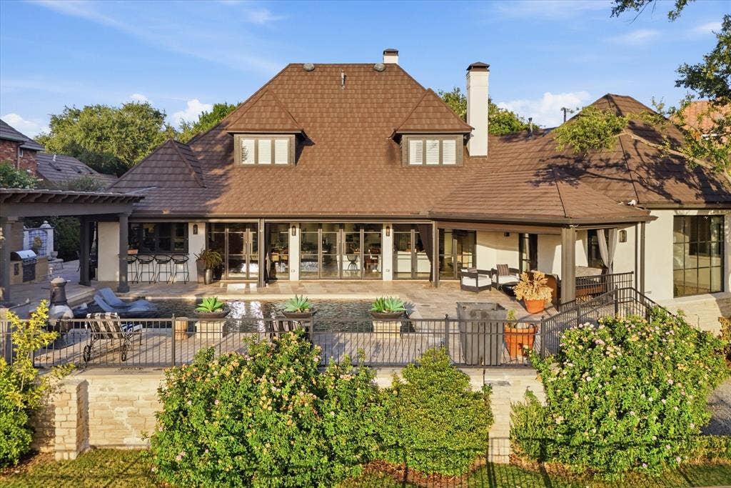5 SAVANNAH Circle, Frisco, TX 75034 The beautifully reimagined residence wraps around its outdoor living spaces, creating exceptional views and connectivity from inside the home.